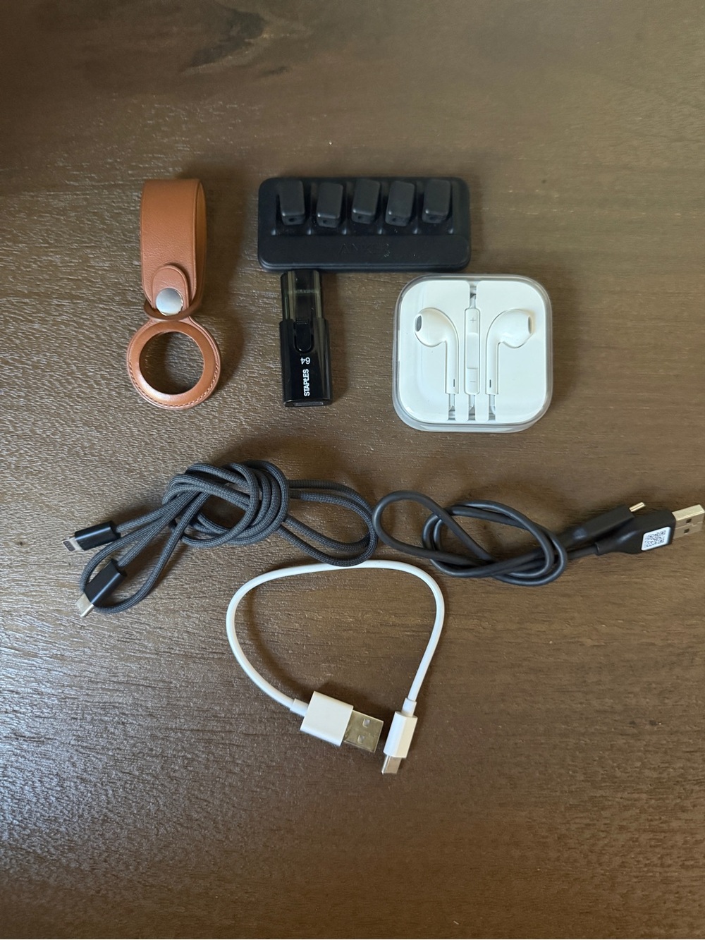 Tech Accessory Bundle with White Earbuds and Brown Leather AirTag Loop